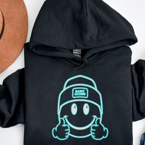 Introducing the ultimate companion for your outdoor adventures – the Happy Camper Hoodie! Designed with the enthusiastic explorer in mind, this hoodie is not just a piece of clothing; it's a declaration of joy and positivity in the great outdoors.